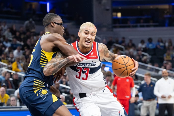 Washington Wizards forward Kyle Kuzma (33) dribbles the ball while Indiana Pacers forward Jalen Smith (25) defends in the first quarter at Gainbridge Fieldhouse.